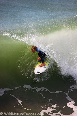 A surfer emerging from the "green room" during the Katin Pro/Am surf tounament, Huntington Beach, California.