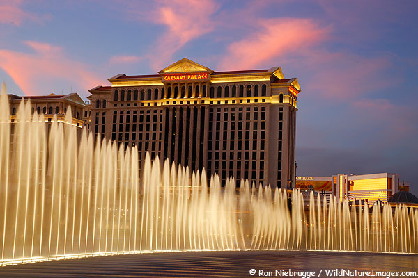 Last nights sunset over Caesars Palace.  The fountains of the Bellagio dance in the foreground, Las Vegas, Nevada.