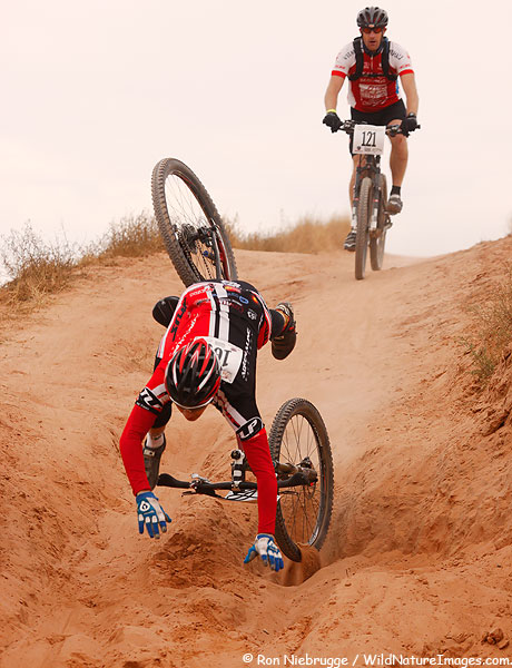 A rider goes head over wheels during the 24 Hours of Moab, in Moab, Utah.