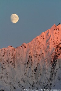Moon rising over the mountains of the Chugach National Forest, Seward, Alaska.