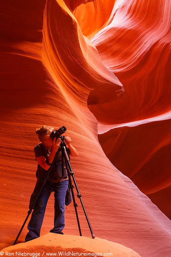 Leah photographing in a slot canyon.