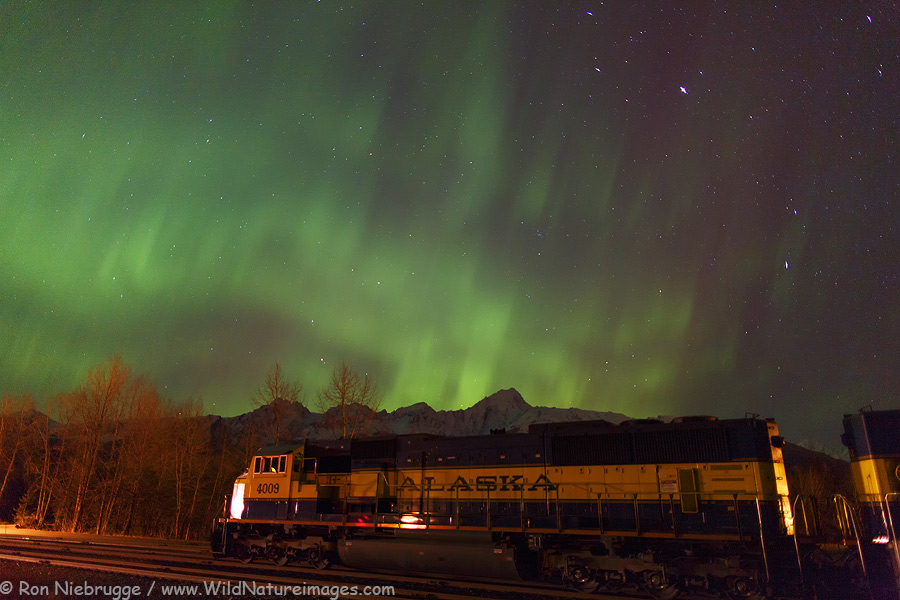 Northern Lights dancing above an engine from the Alaska Railroad, Seward, Alaska.